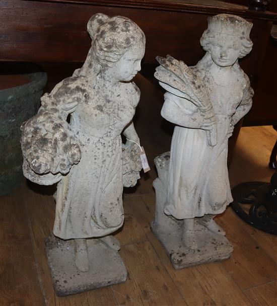A pair of reconstituted stone garden figures tallest 77cm